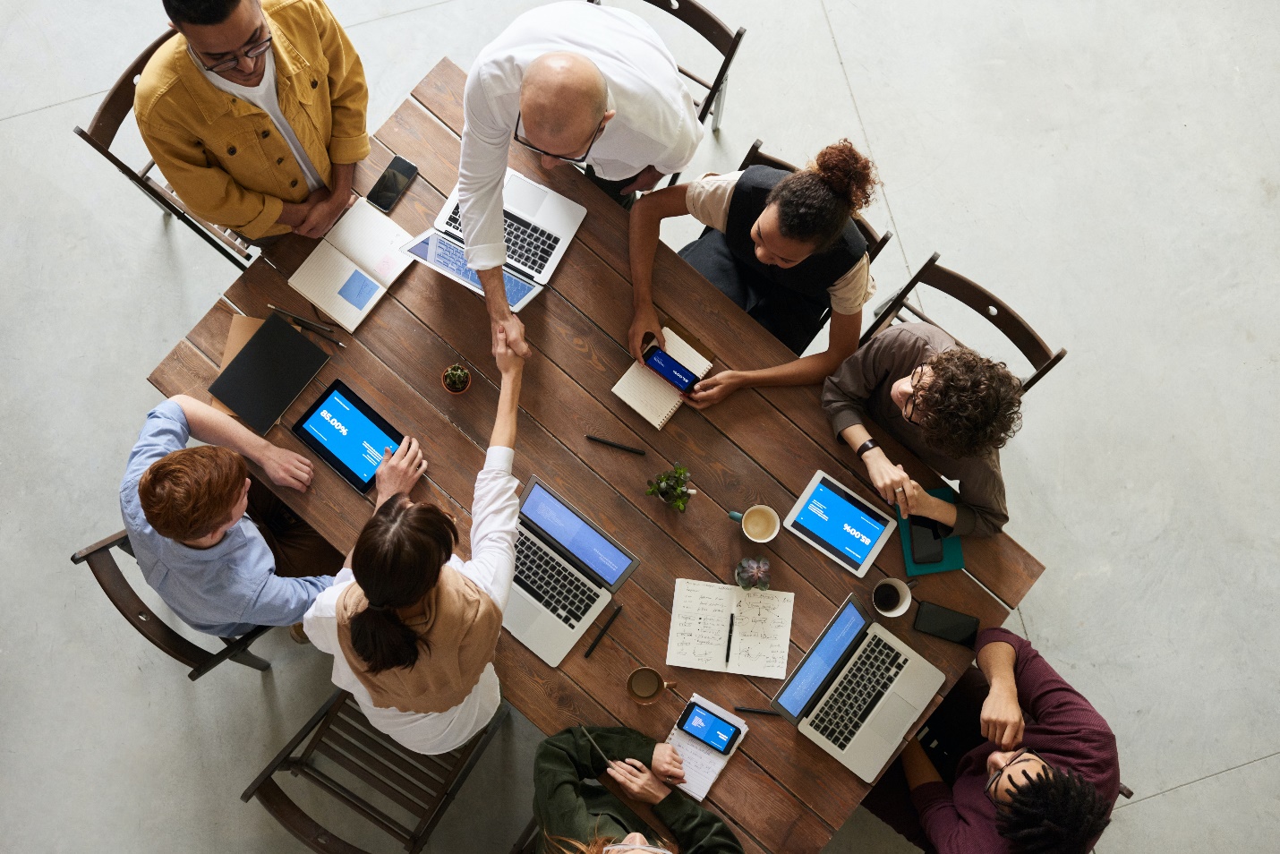 A group of people around a table

Description automatically generated with low confidence